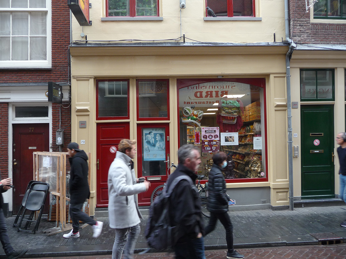 image of people walking past dun yong