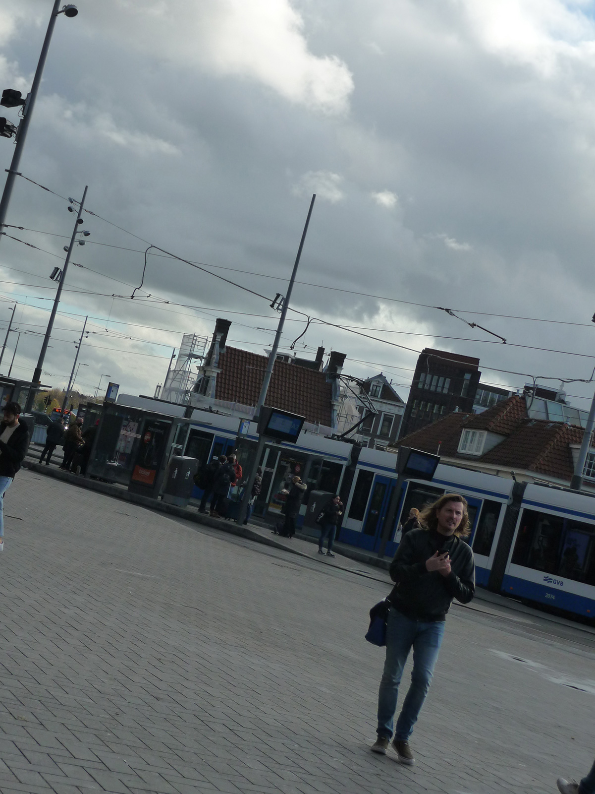 sideways image of a tram near Amsterdam centraal